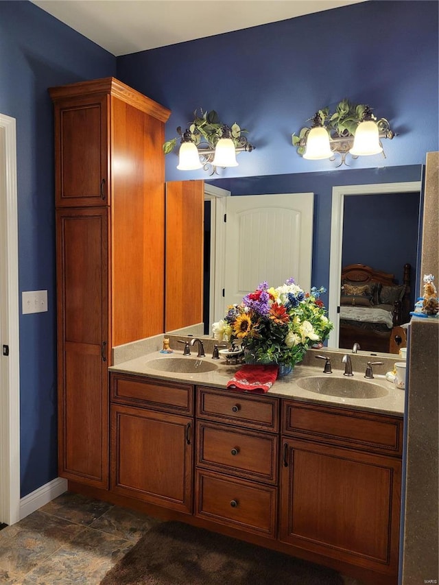 10359 Bounds Rd, Shipman, IL 62685 - bathroom with ensuite bathroom, double vanity, and baseboards