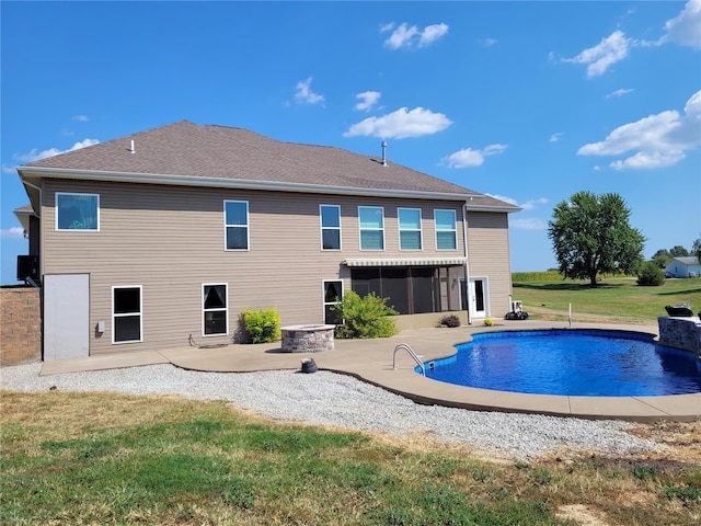 10359 Bounds Rd, Shipman, IL 62685 - rear view of property featuring a patio, a sunroom, an outdoor pool, and a lawn