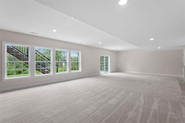 1315 Breezeridge Dr, Saint Louis, MO 63131 - unfurnished living room featuring light carpet, baseboards, and recessed lighting