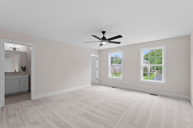 1315 Breezeridge Dr, Saint Louis, MO 63131 - unfurnished bedroom featuring baseboards, connected bathroom, ceiling fan, and light colored carpet