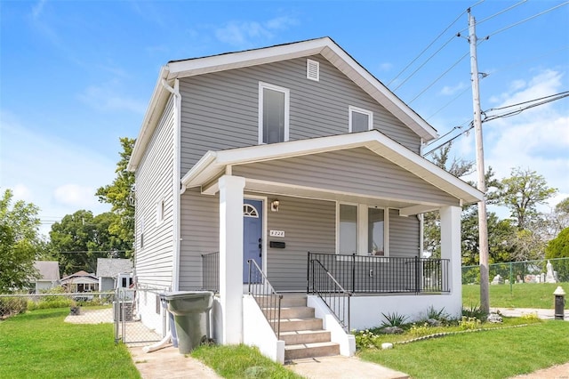 4728 Primm St, Saint Louis, MO 63116 - view of front of home with covered porch and a gate