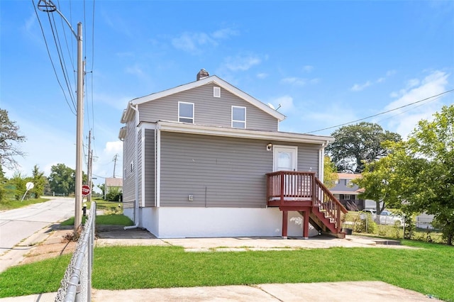 4728 Primm St, Saint Louis, MO 63116 - rear view of house featuring a lawn and a chimney