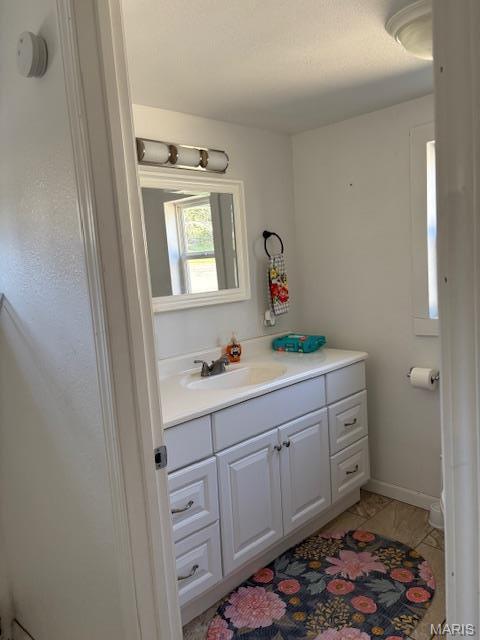 1439 N Spanish St, Cape Girardeau, MO 63701 - bathroom with vanity and tile patterned floors