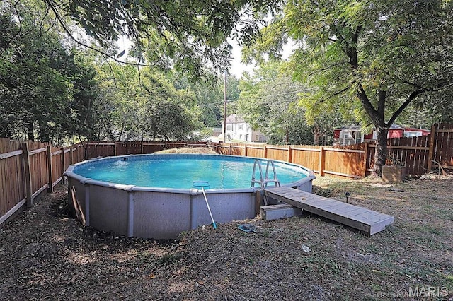 1439 N Spanish St, Cape Girardeau, MO 63701 - view of swimming pool featuring a fenced backyard