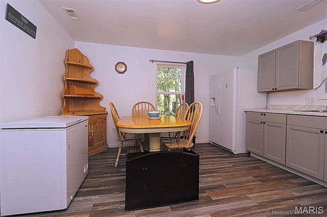 1439 N Spanish St, Cape Girardeau, MO 63701 - dining room featuring dark wood-style flooring
