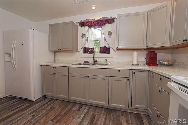 1439 N Spanish St, Cape Girardeau, MO 63701 - kitchen with gray cabinets, white refrigerator with ice dispenser, a sink, dark wood-style floors, and recessed lighting
