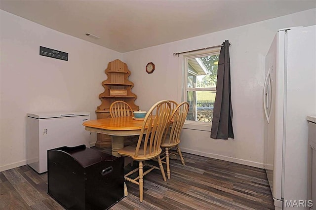1439 N Spanish St, Cape Girardeau, MO 63701 - dining room with dark wood-style flooring and baseboards