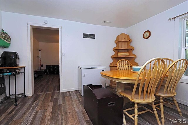 1439 N Spanish St, Cape Girardeau, MO 63701 - dining space featuring dark wood-style floors and baseboards