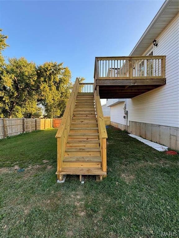 view of yard with stairs and a deck