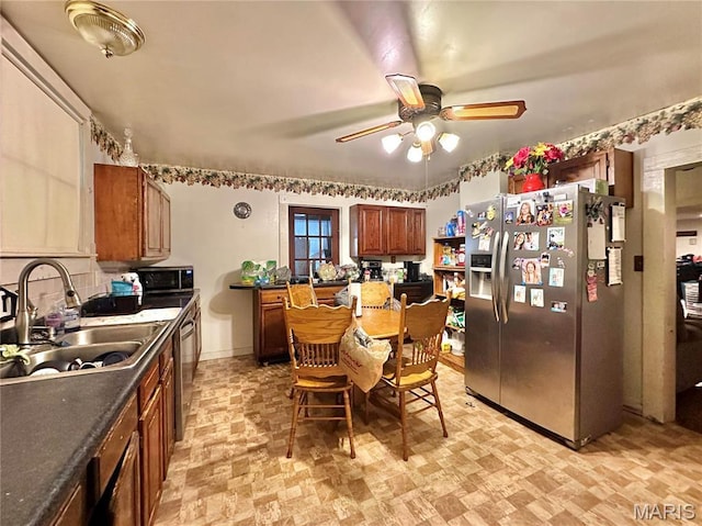 220 Louise St, Bonne Terre, MO 63628 - kitchen featuring stainless steel refrigerator with ice dispenser, a sink, a ceiling fan, dark countertops, and brown cabinetry