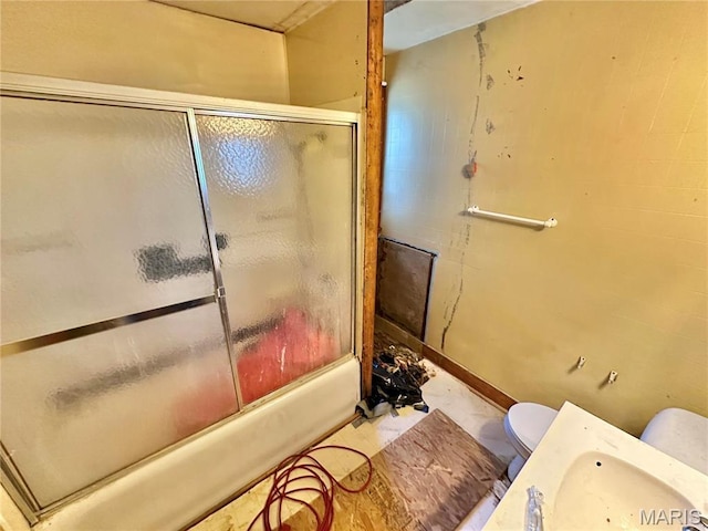 220 Louise St, Bonne Terre, MO 63628 - full bathroom with toilet, enclosed tub / shower combo, and baseboards