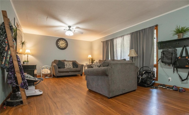 living room with wood finished floors and a ceiling fan