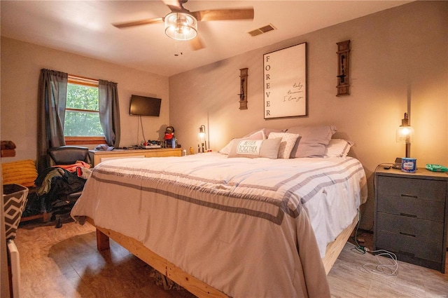 bedroom featuring wood finished floors and ceiling fan