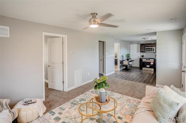 8546 US Highway 50, Lebanon, IL 62254 - carpeted living area with a ceiling fan and baseboards