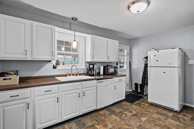 1155 E Karsch Blvd, Farmington, MO 63640 - kitchen with white appliances, a sink, dark countertops, stone finish floors, and white cabinets