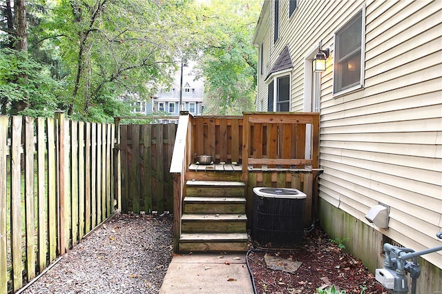 wooden terrace featuring fence and central AC