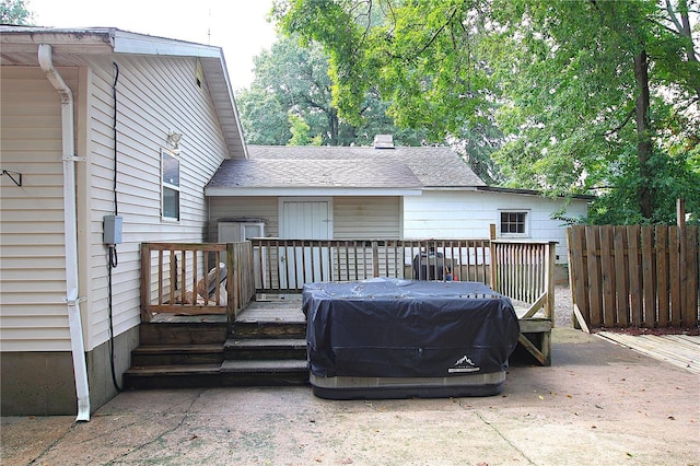 wooden terrace featuring fence