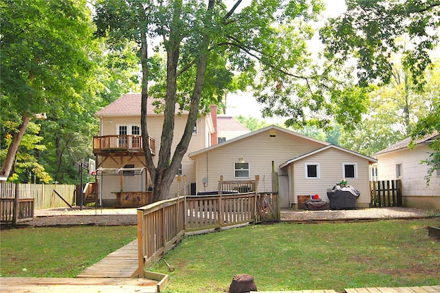 back of property featuring a deck