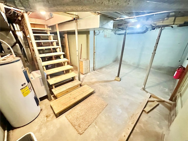 unfinished basement featuring stairway and gas water heater
