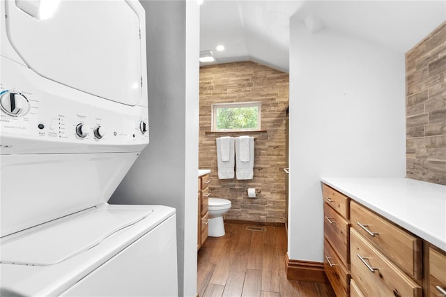 1137 Main St, Maeystown, IL 62256 - bathroom featuring tile walls, stacked washer / dryer, wood finished floors, vanity, and lofted ceiling