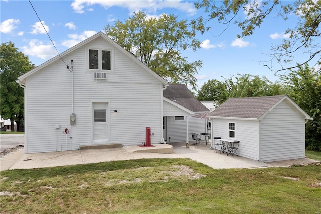 1137 Main St, Maeystown, IL 62256 - rear view of property featuring a yard, a patio area, an outbuilding, and a wall mounted air conditioner