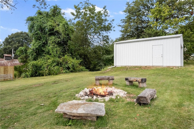 1137 Main St, Maeystown, IL 62256 - view of green lawn featuring a fire pit and an outbuilding