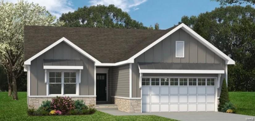 craftsman inspired home with stone siding, board and batten siding, and an attached garage