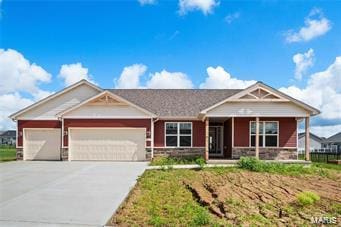 view of front of house featuring a garage, concrete driveway, a porch, and stone siding
