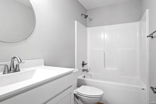 full bathroom featuring toilet, vanity, and bathing tub / shower combination