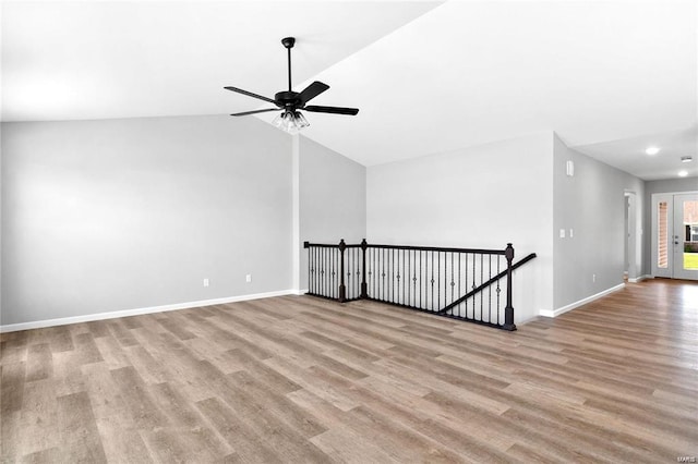 bonus room featuring wood finished floors, a ceiling fan, baseboards, vaulted ceiling, and recessed lighting