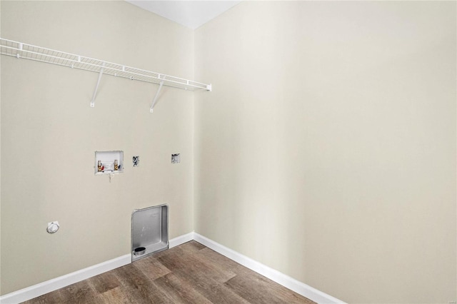 clothes washing area with hookup for a washing machine, dark wood-style flooring, and baseboards