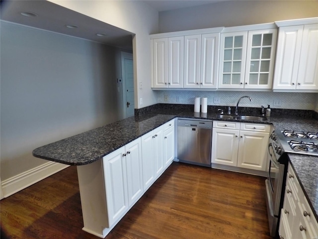 14 N Kingshighway Blvd Unit 7 4Bs, Saint Louis, MO 63108 - kitchen with appliances with stainless steel finishes, a sink, a peninsula, and white cabinets