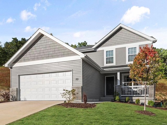 102 Harrow Dr, Ofallon, MO 63385 - craftsman-style house featuring a porch, driveway, a front yard, a garage, and stone siding