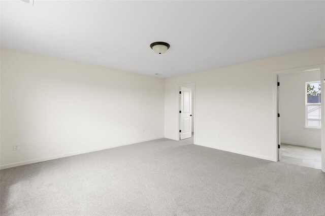 102 Harrow Dr, Ofallon, MO 63385 - unfurnished room with light colored carpet and baseboards