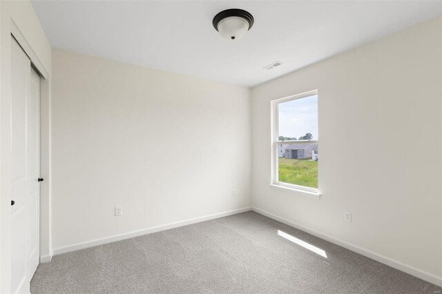 102 Harrow Dr, Ofallon, MO 63385 - unfurnished bedroom with carpet flooring, baseboards, and a closet