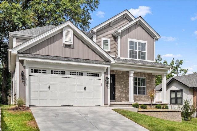 2017 Woodsey Dr, Brentwood, MO 63144 - craftsman-style home with a porch, concrete driveway, stone siding, a garage, and a shingled roof