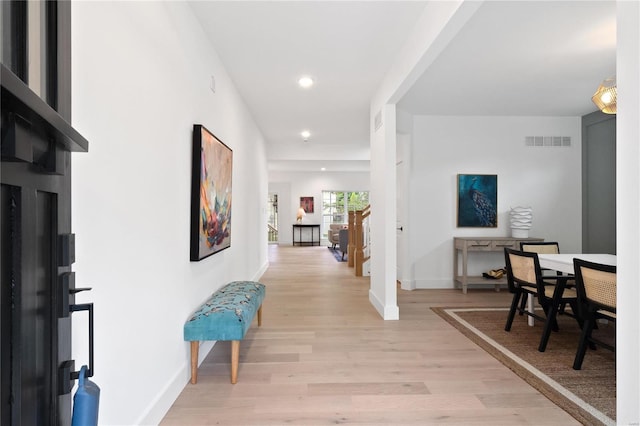2017 Woodsey Dr, Brentwood, MO 63144 - hallway with light wood-style flooring, baseboards, and recessed lighting