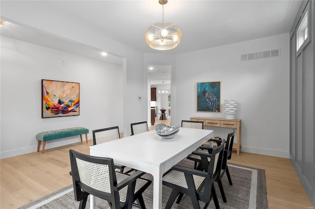 2017 Woodsey Dr, Brentwood, MO 63144 - dining area featuring a chandelier, light wood-style floors, baseboards, and recessed lighting