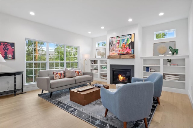 2017 Woodsey Dr, Brentwood, MO 63144 - living room featuring wood finished floors, a fireplace, and recessed lighting
