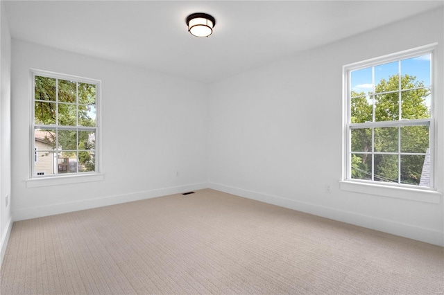 2017 Woodsey Dr, Brentwood, MO 63144 - spare room featuring light carpet and baseboards