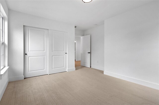 2017 Woodsey Dr, Brentwood, MO 63144 - unfurnished bedroom with light carpet, a closet, and baseboards