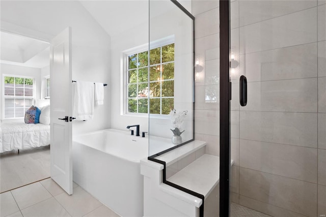 2017 Woodsey Dr, Brentwood, MO 63144 - full bath featuring ensuite bath, a garden tub, a stall shower, tile patterned flooring, and vaulted ceiling
