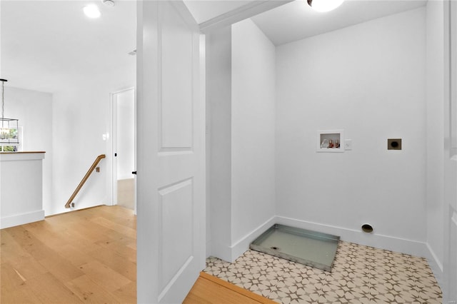 2017 Woodsey Dr, Brentwood, MO 63144 - laundry room featuring electric dryer hookup, hookup for a washing machine, and light wood-type flooring