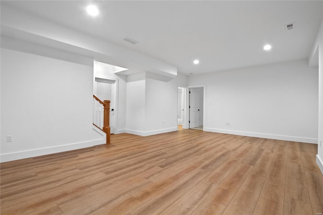 2017 Woodsey Dr, Brentwood, MO 63144 - finished basement featuring stairway, light wood-style flooring, baseboards, and recessed lighting