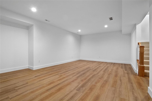2017 Woodsey Dr, Brentwood, MO 63144 - finished basement featuring light wood finished floors, recessed lighting, baseboards, and stairway