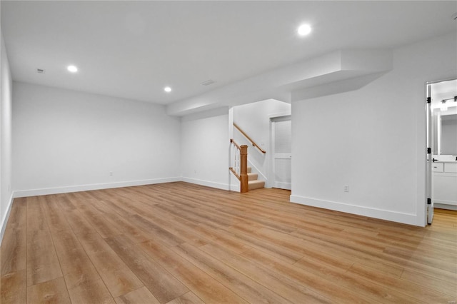 2017 Woodsey Dr, Brentwood, MO 63144 - below grade area with light wood-type flooring, stairway, recessed lighting, and baseboards