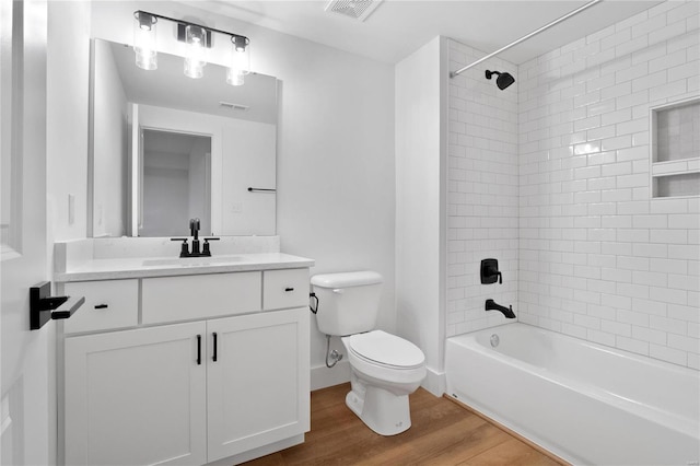 2017 Woodsey Dr, Brentwood, MO 63144 - full bathroom with toilet, wood finished floors, vanity, and bathtub / shower combination