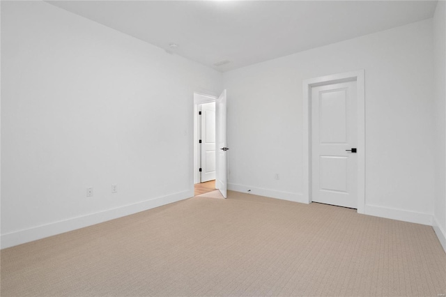 2017 Woodsey Dr, Brentwood, MO 63144 - spare room featuring light carpet and baseboards