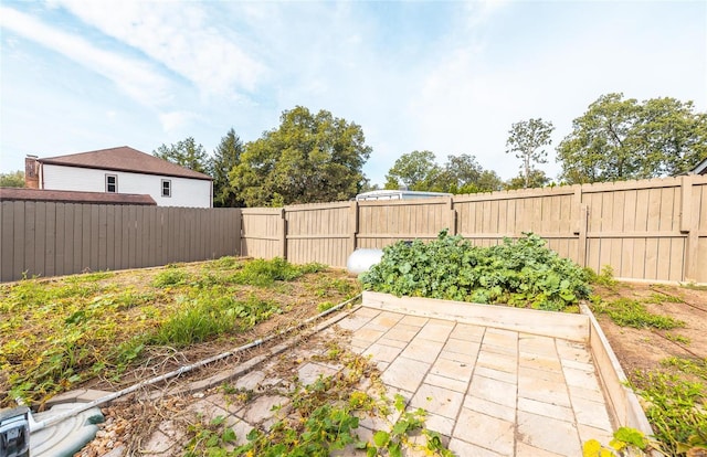 10010 Edmondson Hills Dr, Rolla, MO 65401 - fenced backyard with a vegetable garden