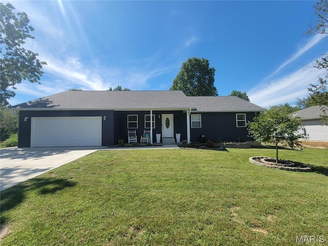 301 S Sloan St, Lebanon, MO 65536 - single story home with a garage, driveway, a front lawn, and covered porch